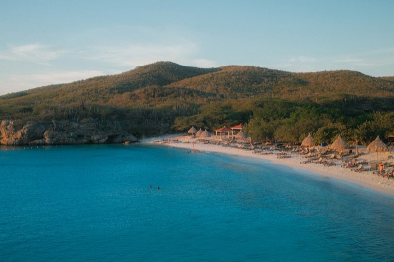 Tropical bay with turquoise water below green hills, Curaçao